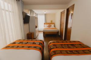 Llit o llits en una habitació de Quechua ApartHotel