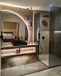 a bathroom with a shower and a bedroom with a bed at Golden City Center Suites in Rhodes Town