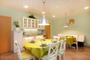 a kitchen and dining room with a table and chairs at Mini-hotel Sofia in Saint Petersburg