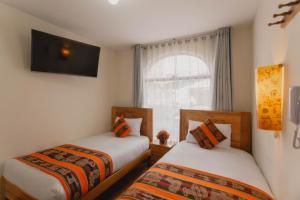 Llit o llits en una habitació de Quechua ApartHotel