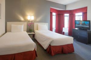 Cama o camas de una habitación en Grant Plaza Hotel