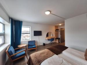 Postel nebo postele na pokoji v ubytování Tjeldsundbrua Hotel