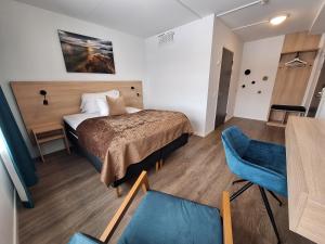 Postel nebo postele na pokoji v ubytování Tjeldsundbrua Hotel