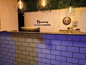 a restaurant counter with a laptop on top of it at Trademark Hostel Sydney in Sydney