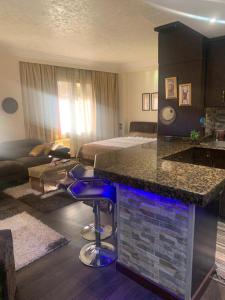 a hotel room with a bar in the middle of a room at Hotel apartment in Monte Cairo Mokattam d202a in Cairo +13 photos