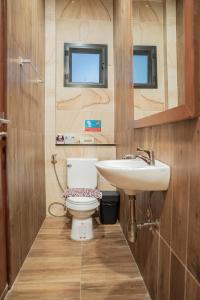 a bathroom with a toilet and a sink at Near beach 3bedroom pool villa.（Rawai VIP B6） in Rawai Beach