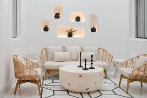 a living room with a couch and chairs and a table at Blue Marina Suites - Boutique Apartments in Arrecife