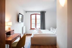 Ein Bett oder Betten in einem Zimmer der Unterkunft Mühle Tornow am Wentowsee