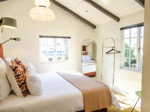 Ένα ή περισσότερα κρεβάτια σε δωμάτιο στο Klein Champagne Guesthouse and Cottages +174 φωτογραφίες