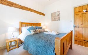 Кровать или кровати в номере The Farmhouse