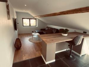 a living room with a table and a couch at Scandinavian appartement in Saint-Avold