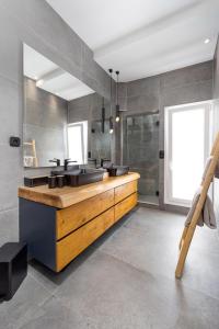 a bathroom with a counter with two sinks at Naxos Town House in Naxos Chora
