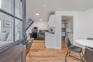 a kitchen and living room with a table and chairs at Tidal House 3 in Ocean Shores