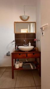 a bathroom with a sink and a mirror at Angel House in Drosia +54 photos