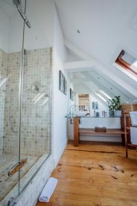 a bathroom with a walk in shower and a sink at Bonne Esperance Boutique Guest House in Stellenbosch
