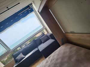 Ένα ή περισσότερα κρεβάτια σε δωμάτιο στο L escatade de Saint jean de monts