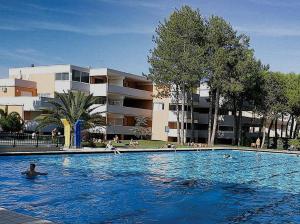 a large swimming pool in front of a building at RESIDENCE SOLARIUM, CORMOR 33 in Bibione