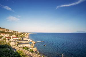 an aerial view of a town and the ocean at Above Blue Villas in Plomari