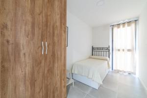 Postel nebo postele na pokoji v ubytování Calafell Seaside Escape