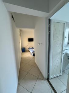 a hallway with a door leading to a bedroom at Prijevor Apartments in Budva