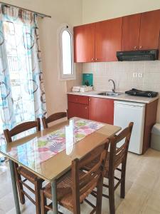 A kitchen or kitchenette at Angelica Studios and Apartments