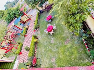 an aerial view of a park with tables and chairs at Bundeli Farm Resort & Banquet Orchha in Orchha