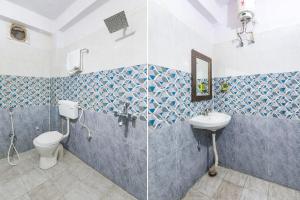 a bathroom with two toilets and a sink at FabHotel Magadh Regency in Patna