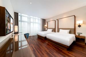 Voodi või voodid majutusasutuse SSAW Boutique Hotel Foshan Qiandeng Lake toas