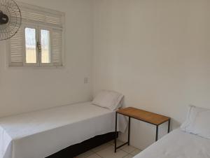 Krevet ili kreveti u jedinici u objektu Angelus Hotel & Estacionamento