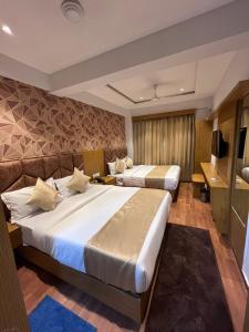 Postel nebo postele na pokoji v ubytování Hotel Privilon