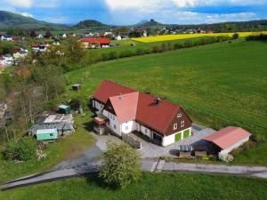 an aerial view of a large house in a field at Ferienwohnung SandSteinLand in Reinhardtsdorf