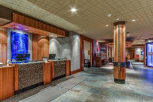 a lobby with a reception desk in a building at The Listel Hotel Whistler in Whistler