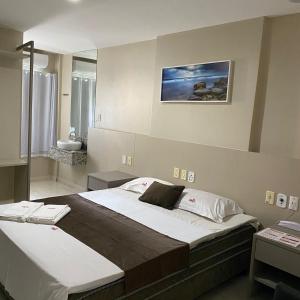 מיטה או מיטות בחדר ב-Onix Hotel Aeroporto