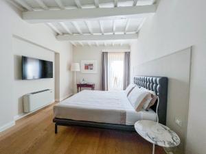 Postelja oz. postelje v sobi nastanitve Suite Greve in Chianti