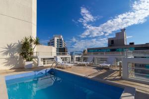 a swimming pool on the roof of a building at Rio Branco Hotel in Florian&oacute;polis