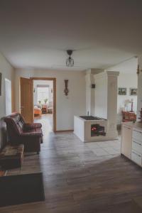 a living room with a couch and a fireplace at Aimasas in Soleimi