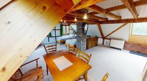 a dining room with a table and a fireplace at Haan-Ferienwohnung in Haan +11 photos