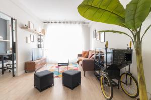 a living room with a bike parked in a room at BILBAO ARGIA in Bilbao