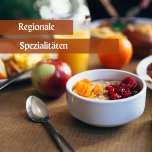 a bowl of oatmeal with fruit and a spoon at Hotel Lava Inn - 24 h Check-In - Nähe LKH, Landeskrankenhaus, Feldbach in Feldbach