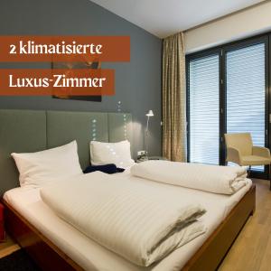 Postel nebo postele na pokoji v ubytování Hotel Lava Inn - 24 h Check-In - Nähe LKH, Landeskrankenhaus, Feldbach