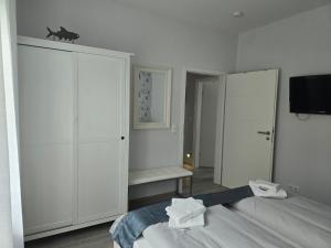 Postel nebo postele na pokoji v ubytování Ferienhaus Savannah-Blue