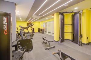 a gym with treadmills and machines in a room at Transamerica Fit Villa Lobos in Sao Paulo