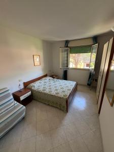 Postel nebo postele na pokoji v ubytování Residence Verde Pineta + 19 fotografií