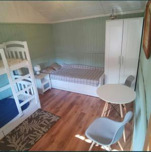 Postel nebo postele na pokoji v ubytování Domek pod brzozami