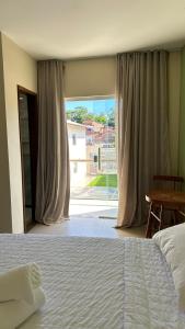 Cama ou camas em um quarto em Humaita Pousada
