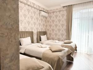Voodi või voodid majutusasutuse Armenia Hotel toas