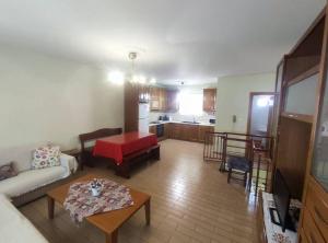 a living room with a couch and a table at Stylish Modern Maisonette in Thessaloniki
