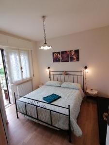 a bedroom with a large bed in a room at Flavia in Cividale del Friuli