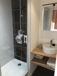 a bathroom with a shower and a sink at Joli studio sur le port in Pornic +20 photos