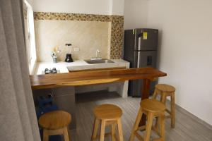 Kuchyň nebo kuchyňský kout v ubytování Apartamento Villa Carolina 101